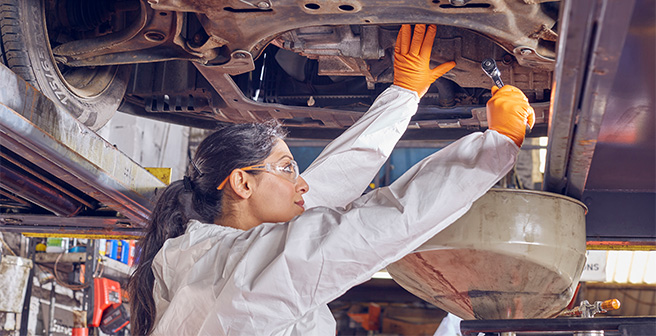 Female industrial worker wearing MICROFLEX 93 256 glove